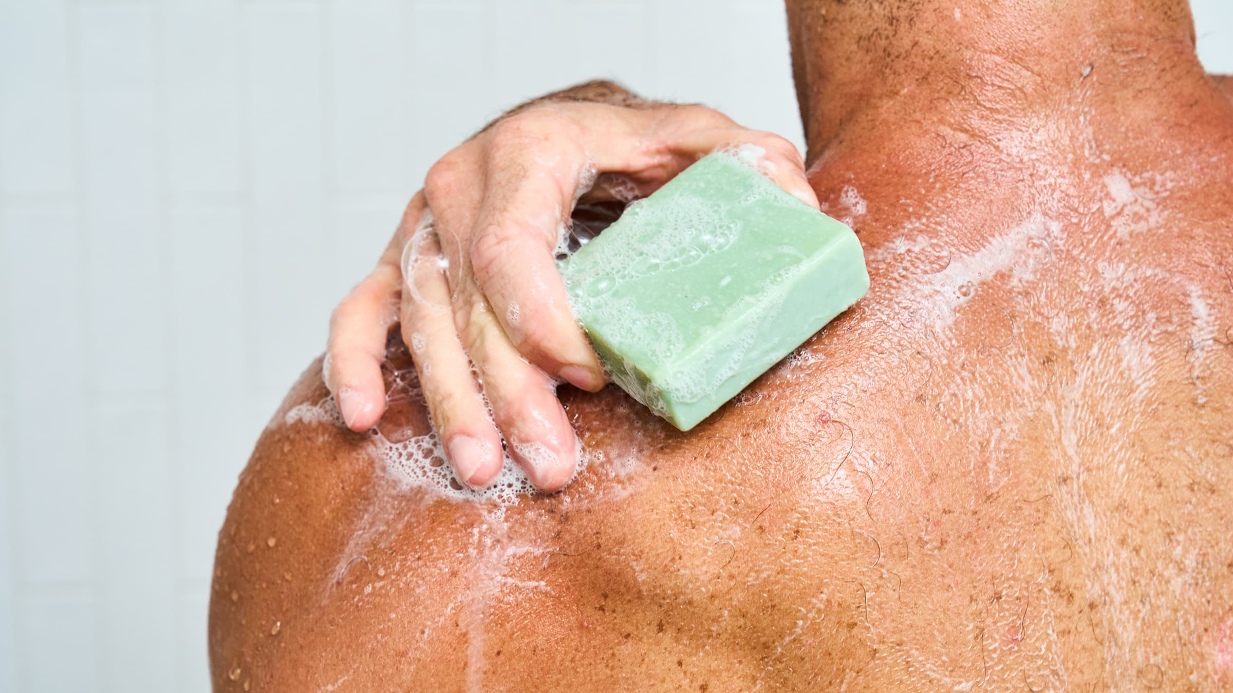 Dr. Squatch Green Tea Butter bar soap being used